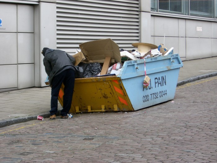 man_rummaging_thought_a_skip.jpg man_rummaging_thought_a_skip.jpg